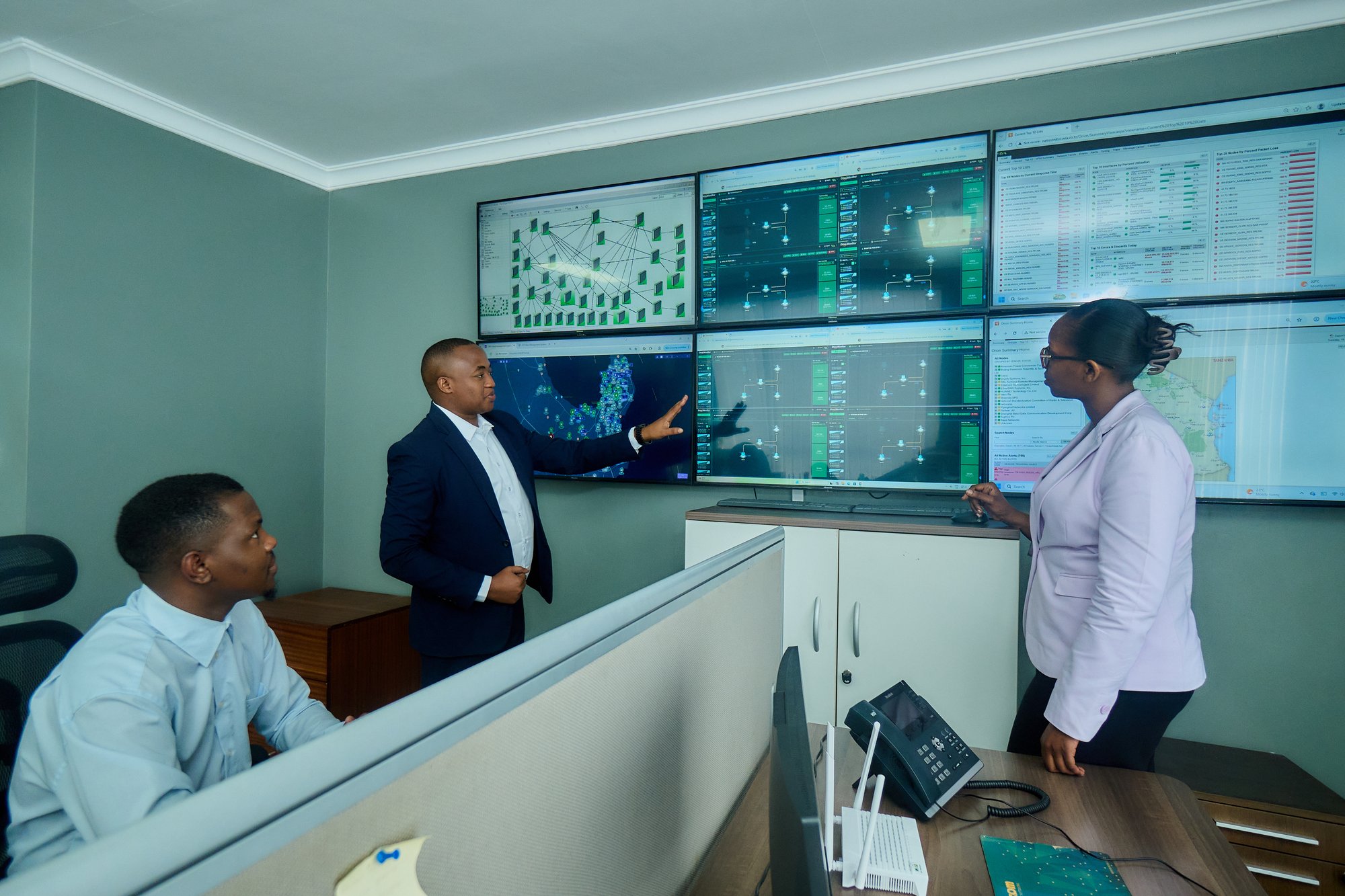WiA technical team reviewing network monitoring dashboards